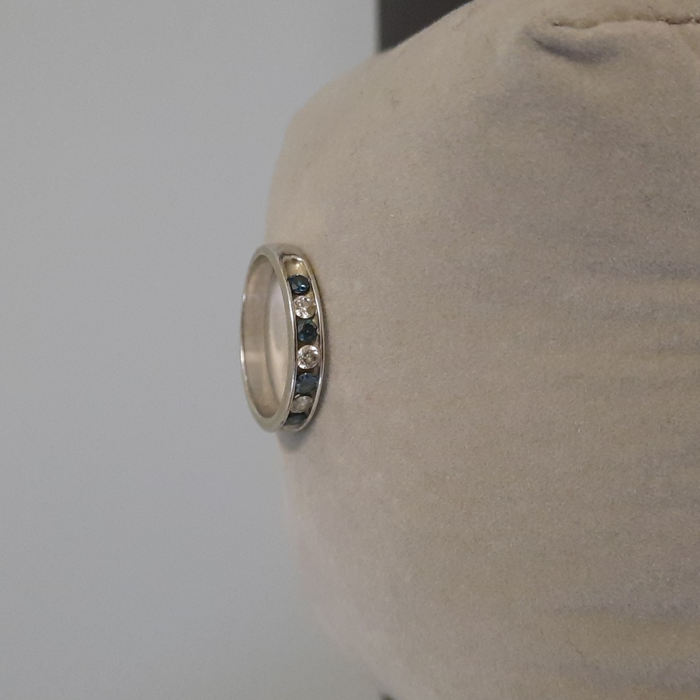 REEDS size 6US, 10k white gold, 1/2cwt blue and white diamonds